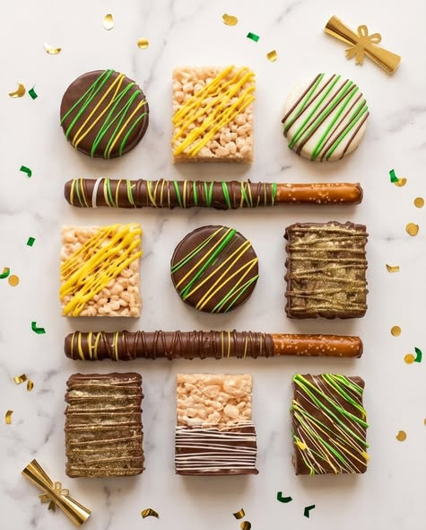 Variety of dipped Oreos, pretzel rods, and Rice Krispies treats